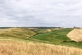 Tuscany rolling hills with cultivated meadows and lone farms in Val d`Orcia, Italy Royalty Free Stock Photo