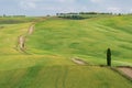 Tuscany rural landscape in Crete Senesi, landscape with green rolling hills and cypresses in Val d\'Orcia, Italy Royalty Free Stock Photo