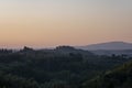 Tuscany, rural landscape in Crete Senesi land. Rolling hills, countryside farm, cypresses trees, green field on warm sunset. Siena Royalty Free Stock Photo