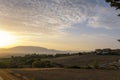 Tuscany, rural landscape in Crete Senesi land. Rolling hills, countryside farm, cypresses trees, green field on warm sunset. Siena Royalty Free Stock Photo