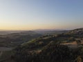 Tuscany, rural landscape in Crete Senesi land. Rolling hills, countryside farm, cypresses trees, green field on warm sunset. Siena Royalty Free Stock Photo