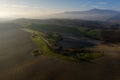 Tuscany, Siena, October 19, 2019. Aerial view of the fields, wineries near San Quirico d`Orcia. Tuscany autumn sunrise