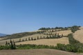 Tuscany sunny landscape. Typical for the region tuscan farm house, hills, vineyard. Italy Royalty Free Stock Photo