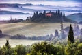 Tuscany villa in the misty valley Royalty Free Stock Photo