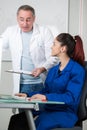 tutor assisting woman during computer class Royalty Free Stock Photo