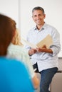 Tutor with class of students Royalty Free Stock Photo