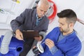 tutor instructing trainee electrician Royalty Free Stock Photo