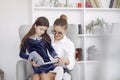 Tutor with litthe girl studying at home Royalty Free Stock Photo