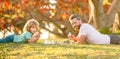 tutorship. dad and kid play logic game. father and son playing chess relaxing on grass.