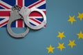 Tuvalu flag and police handcuffs. The concept of crime and offenses in the country