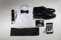 Tuxedo. Arm buttons, white shirt, black bow tie, belt, classic shoes and wallet Royalty Free Stock Photo