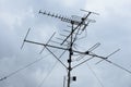 TV antenna on a background cloudy sky. Analog and digital tv signal