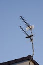 TV antenna on blue sky background