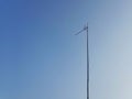 TV antenna on blue sky background Royalty Free Stock Photo