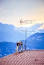 TV Antenna on the roof of an Italian house, Sunset Royalty Free Stock Photo