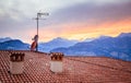 TV Antenna on the roof of an Italian house, Sunset Royalty Free Stock Photo