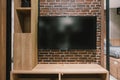 TV with blank screen and shelf cabinet at night, interior design Royalty Free Stock Photo