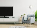 TV on the cabinet in modern living room with blue armchair on white wall background