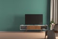 TV on the cabinet in modern living room on turquoise wall background