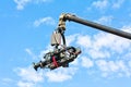 Tv camera on a crane against blue sky Royalty Free Stock Photo
