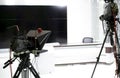 TV camera in the Studio. Teleprompter and professional high-definition video camera on a tripod.