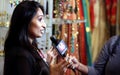 TV channel Reporter interview woman fashion accessories shop owne