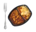 TV dinner of chicken chunks in barbecue sauce plus potatoes Royalty Free Stock Photo