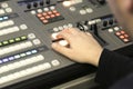 TV editor working with audio video mixer in a television broadcast Royalty Free Stock Photo