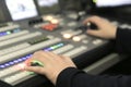 TV editor working with audio video mixer in a television broadcast Royalty Free Stock Photo