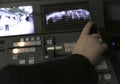 TV editor working with audio video mixer in a television broadcast