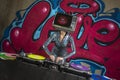 Tv head woman and graffiti wall dj