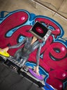 Tv head woman and graffiti wall dj