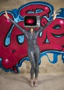 Tv head woman and graffiti wall