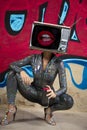 Tv head woman and graffiti wall