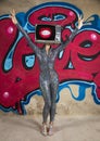 Tv head woman and graffiti wall