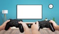 TV mockup for game presentation. Two friends holding gamepads Royalty Free Stock Photo