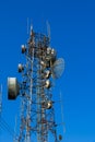 TV radio antenna tower station with old parabolic antenna and satellite dish, Television broadcast network signal. Royalty Free Stock Photo