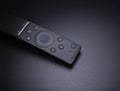 Tv remote closeup on a durk black background. Royalty Free Stock Photo