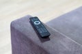 TV remote contoller lying on the coach Royalty Free Stock Photo