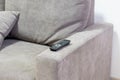 TV remote contoller lying on the coach Royalty Free Stock Photo