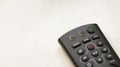 TV remote control with focus on and off button on a white background. Royalty Free Stock Photo