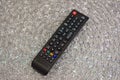 TV remote control on a gray background