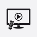 TV with remote control and play button on screen icon Royalty Free Stock Photo