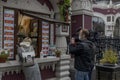 TV reporter interviewing a seller of street food kiosk