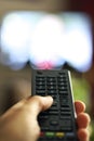 TV remote control device on hand Royalty Free Stock Photo