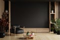 TV room interior with black leather armchair on empty dark wall background Royalty Free Stock Photo