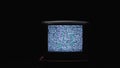 TV screen on at night with a white noise. Stock. Static noise on the old TV screen in the dark Royalty Free Stock Photo