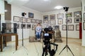 TV shooting at the Museum. LCD monitor on the camcorder. The girl in front of the camera. A record of the interview Royalty Free Stock Photo