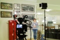 TV shooting at the Museum. LCD monitor on the camcorder. The girl in front of the camera. A record of the interview