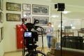 TV shooting at the Museum. LCD monitor on the camcorder. The girl in front of the camera. A record of the interview